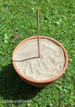 Stab in den gerade in den Sand stecken