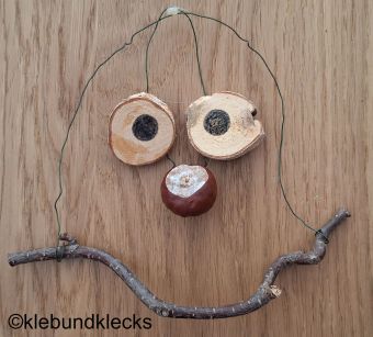 Waldgeister aus Ästen, Holzscheiben und Kastanien